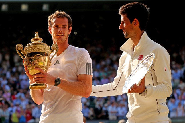 LONDON, ENGLAND - JULY 07: Andy Murray of Great Britain poses with the Gentlemen's Singles Trophy next to Novak Djokovic of Serbia following his victory in the Gentlemen's Singles Final match on day thirteen of the Wimbledon Lawn Tennis Championships at the All England Lawn Tennis and Croquet Club on July 7, 2013 in London, England. (Photo by Clive Brunskill/Getty Images)