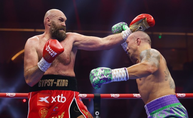 RIYADH, SAUDI ARABIA - DECEMBER 21: Tyson Fury punches Oleksandr Usyk during the IBF, IBO, WBA, WBC and WBO Undisputed World Heavyweight titles' fight between Oleksandr Usyk and Tyson Fury as part of Oleksandr Usyk v Tyson Fury 2, Reignited card at Kingdom Arena on December 21, 2024 in Riyadh, Saudi Arabia. (Photo by Richard Pelham/Getty Images)