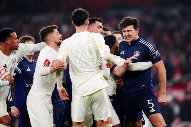 Tempers flare between Manchester United's Harry Maguire (right) and Arsenal's Kai Havertz after Arsenal are awarded a penalty during the Emirates FA Cup third round match at the Emirates Stadium, London. Picture date: Sunday January 12, 2025. PA Photo. See PA story SOCCER Arsenal. Photo credit should read: Mike Egerton/PA Wire. RESTRICTIONS: EDITORIAL USE ONLY No use with unauthorised audio, video, data, fixture lists, club/league logos or "live" services. Online in-match use limited to 120 images, no video emulation. No use in betting, games or single club/league/player publications.