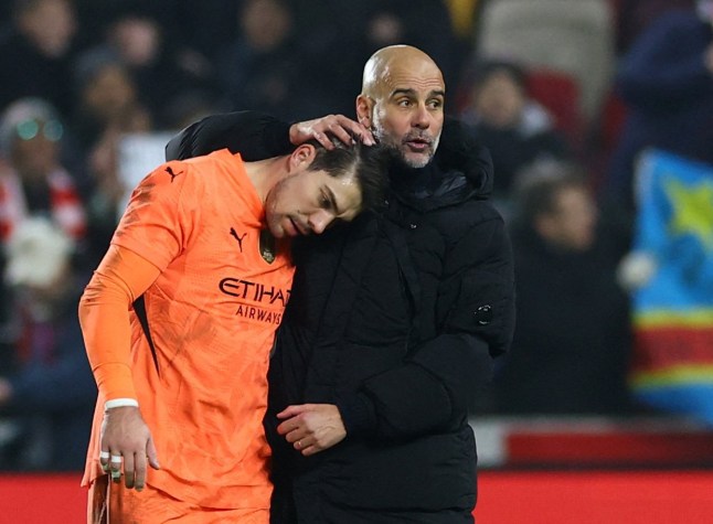 Soccer Football - Premier League - Brentford v Manchester City - GTech Community Stadium, London, Britain - January 14, 2025 Manchester City manager Pep Guardiola consoles Stefan Ortega after the match Action Images via Reuters/Matthew Childs EDITORIAL USE ONLY. NO USE WITH UNAUTHORIZED AUDIO, VIDEO, DATA, FIXTURE LISTS, CLUB/LEAGUE LOGOS OR 'LIVE' SERVICES. ONLINE IN-MATCH USE LIMITED TO 120 IMAGES, NO VIDEO EMULATION. NO USE IN BETTING, GAMES OR SINGLE CLUB/LEAGUE/PLAYER PUBLICATIONS. PLEASE CONTACT YOUR ACCOUNT REPRESENTATIVE FOR FURTHER DETAILS..