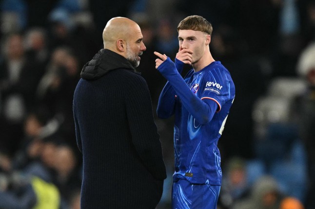 Manchester City's Spanish manager Pep Guardiola (L) talks with Chelsea's English midfielder #20 Cole Palmer as the leave the pitch after the English Premier League football match between Manchester City and Chelsea at the Etihad Stadium in Manchester, north west England, on January 25, 2025. Manchester City won the match 3-1. (Photo by Oli SCARFF / AFP) / RESTRICTED TO EDITORIAL USE. No use with unauthorized audio, video, data, fixture lists, club/league logos or 'live' services. Online in-match use limited to 120 images. An additional 40 images may be used in extra time. No video emulation. Social media in-match use limited to 120 images. An additional 40 images may be used in extra time. No use in betting publications, games or single club/league/player publications. / (Photo by OLI SCARFF/AFP via Getty Images)