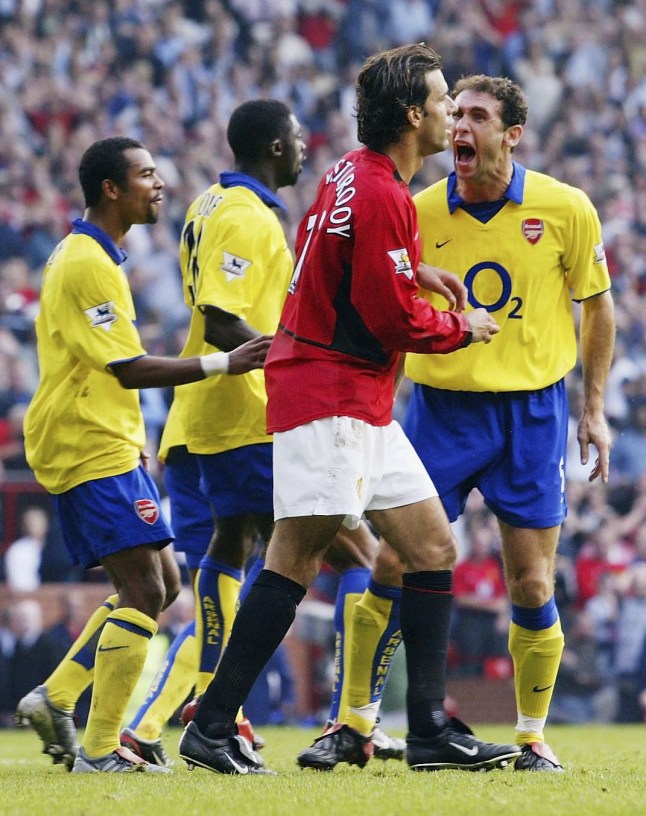 MANCHESTER, ENGLAND - SEPTEMBER 21: Martin Keown of Arsenal shows his feelings at Ruud Van Nistelrooy of Man Utd after he misses his penalty during the FA Barclaycard Premiership match between Manchester United and Arsenal at Old Trafford on September 21, 2003 in Manchester, England. (Photo by Shaun Botterill/Getty Images)