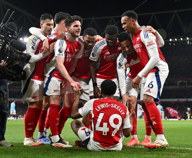 LONDON, ENGLAND - FEBRUARY 02: Myles Lewis-Skelly (on ground) celebrates scoring the 3rd Arsenal goal with (L-R) Gabriel Martinelli, Declan Rice, Jurrien Timber, Thomas Partey, William Saliba and Gabriel during the Premier League match between Arsenal FC and Manchester City FC at Emirates Stadium on February 02, 2025 in London, England. (Photo by Stuart MacFarlane/Arsenal FC via Getty Images)