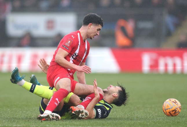 LONDON, ENGLAND - FEBRUARY 08: Nico Gonzalez of Manchester City is challenged by Sonny Perkins of Leyton Orient during the Emirates FA Cup Fourth Round match between Leyton Orient and Manchester City at Gaughan Group Stadium on February 08, 2025 in London, England. (Photo by Richard Pelham/Getty Images)