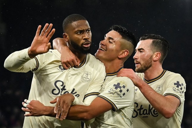 Everton's Portuguese striker #14 Beto (L) celebrates with teammates after scoring his team first goal during the English Premier League football match between Crystal Palace and Everton at Selhurst Park in south London on February 15, 2025. (Photo by Glyn KIRK / AFP) / RESTRICTED TO EDITORIAL USE. No use with unauthorized audio, video, data, fixture lists, club/league logos or 'live' services. Online in-match use limited to 120 images. An additional 40 images may be used in extra time. No video emulation. Social media in-match use limited to 120 images. An additional 40 images may be used in extra time. No use in betting publications, games or single club/league/player publications. / (Photo by GLYN KIRK/AFP via Getty Images)