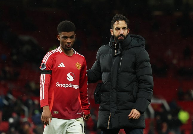 Soccer Football - Premier League - Manchester United v Nottingham Forest - Old Trafford, Manchester, Britain - December 7, 2024 Manchester United's Amad Diallo and manager Ruben Amorim look dejected after the match Action Images via Reuters/Lee Smith EDITORIAL USE ONLY. NO USE WITH UNAUTHORIZED AUDIO, VIDEO, DATA, FIXTURE LISTS, CLUB/LEAGUE LOGOS OR 'LIVE' SERVICES. ONLINE IN-MATCH USE LIMITED TO 120 IMAGES, NO VIDEO EMULATION. NO USE IN BETTING, GAMES OR SINGLE CLUB/LEAGUE/PLAYER PUBLICATIONS. PLEASE CONTACT YOUR ACCOUNT REPRESENTATIVE FOR FURTHER DETAILS..