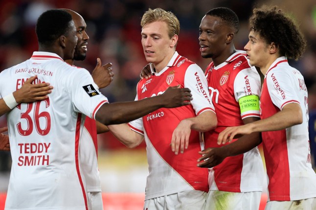 Monaco's Danish forward #14 Mika Biereth (C) celebrates with teammates after scoring his team's third goal during the French L1 football match between AS Monaco and Stade de Reims at the Louis II Stadium (Stade Louis II) in the Principality of Monaco on February 28, 2025. (Photo by Valery HACHE / AFP) (Photo by VALERY HACHE/AFP via Getty Images)