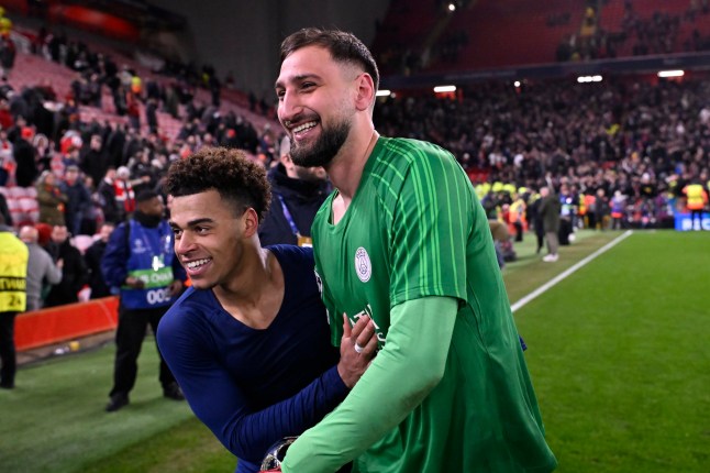 LIVERPOOL, ENGLAND - MARCH 11: Gianluigi Donnarumma and Desire Doue of Paris Saint-Germain react after winning the UEFA Champions League 2024/25 UEFA Champions League 2024/25 Round of 16 Second Leg match between Liverpool FC and Paris Saint-Germain at Anfield on March 11, 2025 in Liverpool, England. (Photo by Aurelien Meunier - PSG/PSG via Getty Images)