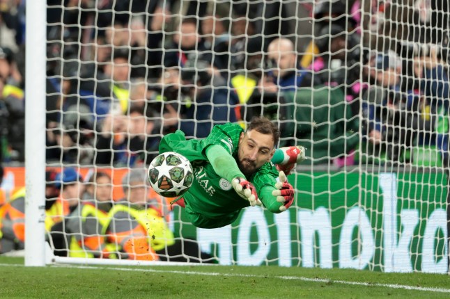 LIVERPOOL, ENGLAND - MARCH 11: PSG goalkeeper Gianluigi Donnarumma stops his first penalty kick during the penalty shootout ot the UEFA Champions League 2024/25 UEFA Champions League 2024/25 Round of 16 Second Leg match between Liverpool FC and Paris Saint-Germain (PSG) at Anfield on March 11, 2025 in Liverpool, England. (Photo by Jean Catuffe/Getty Images)