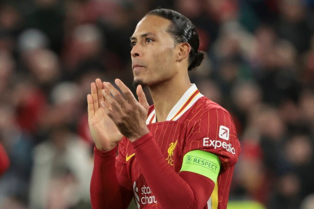 LIVERPOOL, ENGLAND - MARCH 11: Virgil Van Dijk of Liverpool salutes the supporters following the penalty shootout of the UEFA Champions League 2024/25 UEFA Champions League 2024/25 Round of 16 Second Leg match between Liverpool FC and Paris Saint-Germain (PSG) at Anfield on March 11, 2025 in Liverpool, England. (Photo by Jean Catuffe/Getty Images)