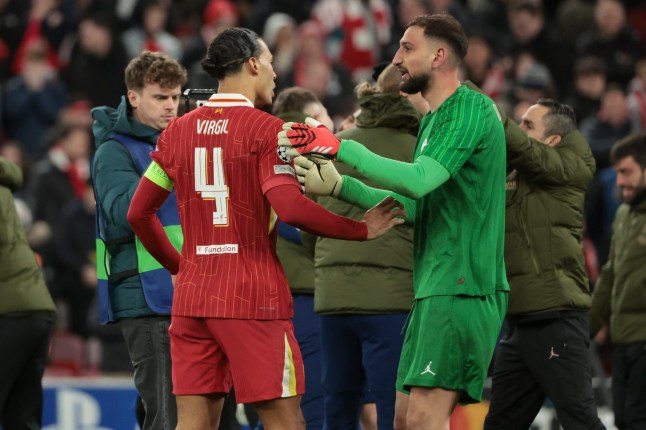 LIVERPOOL, ENGLAND - MARCH 11: Virgil Van Dijk of Liverpool greets PSG goalkeeper Gianluigi Donnarumma following the penalty shootout of the UEFA Champions League 2024/25 UEFA Champions League 2024/25 Round of 16 Second Leg match between Liverpool FC and Paris Saint-Germain (PSG) at Anfield on March 11, 2025 in Liverpool, England. (Photo by Jean Catuffe/Getty Images)