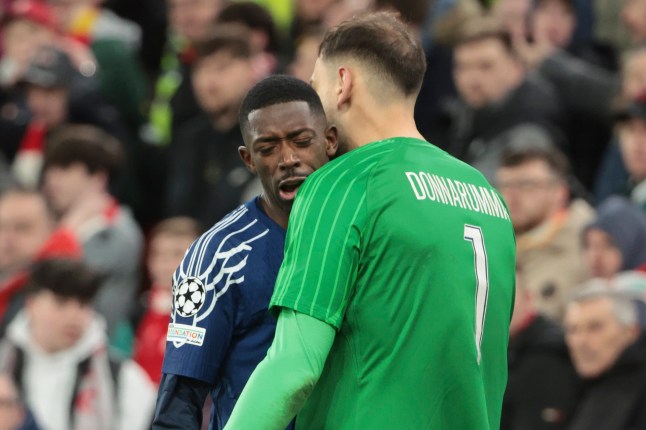 LIVERPOOL, ENGLAND - MARCH 11: Ousmane Dembele of PSG celebrates scoring his penalty with PSG goalkeeper Gianluigi Donnarumma during the penalty shootout of the UEFA Champions League 2024/25 UEFA Champions League 2024/25 Round of 16 Second Leg match between Liverpool FC and Paris Saint-Germain (PSG) at Anfield on March 11, 2025 in Liverpool, England. (Photo by Jean Catuffe/Getty Images)