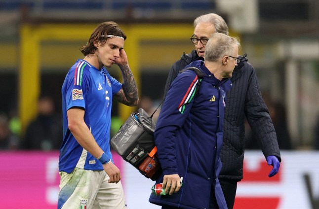 Soccer Football - Nations League - Quarter Final - First Leg - Italy v Germany - San Siro, Milan, Italy - March 20, 2025 Italy's Riccardo Calafiori walks off the pitch after sustaining an injury REUTERS/Claudia Greco